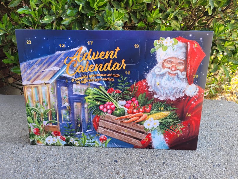 May include: Advent calendar with a Santa Claus illustration holding a wooden crate filled with vegetables. The calendar has a blue background with a greenhouse illustration and the text "Advent Calendar".