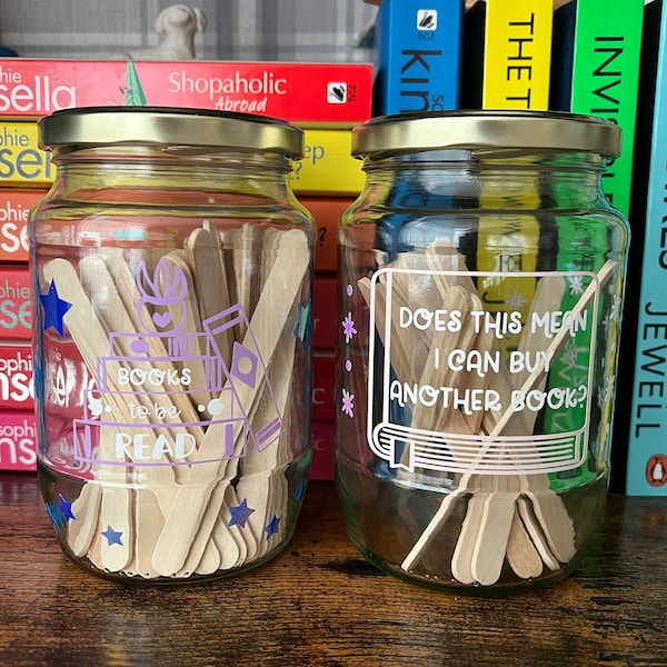 Books to be read and Tracker glass jars with gold lid