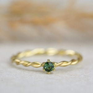 Engagement ring " Milou " with tourmaline made of 585/- yellow gold with claw setting, cord ring side ring, gemstone green blue
