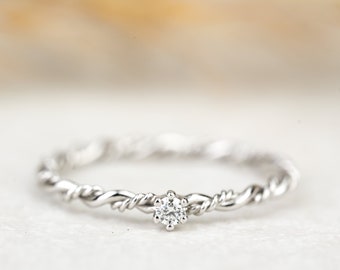 Engagement ring "Filou" made of 585/- white gold with prong setting and diamond, cord ring