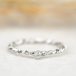 Engagement ring "Filou" made of 585/- white gold with prong setting and diamond, cord ring