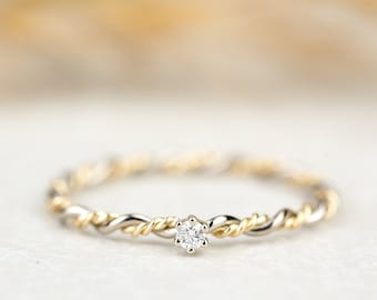 Engagement ring "Filou" made of 585/- white gold yellow gold bicolor with claw setting and diamond, cord ring