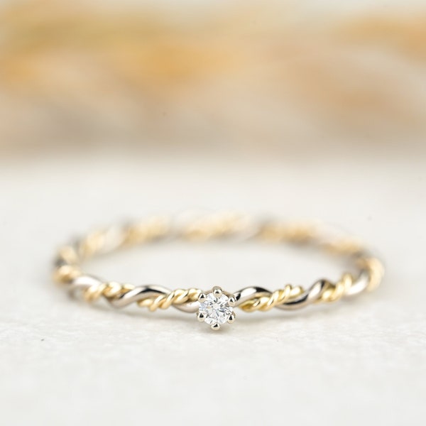Engagement ring "Filou" made of 585/- white gold yellow gold bicolor with claw setting and diamond, cord ring