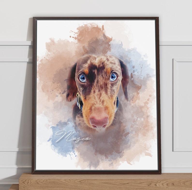May include: A framed watercolor portrait of a Dachshund dog with brown and tan fur and striking blue eyes. The artwork features a soft, blended background of brown and blue hues, with the name "Mosco" in cursive script.