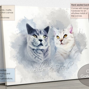 May include: Canvas gallery wrap featuring a watercolor-style portrait of two cats, one gray and one white, with yellow eyes. The canvas is printed on 100% cotton canvas with a 1.25-inch MDF frame. The artwork is titled "Bilbo & Frodo."