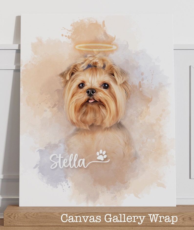 May include: Canvas gallery wrap featuring a portrait of a Yorkshire Terrier with a halo. The dog has light brown fur and a small pink tongue. The name "Stella" and a paw print are below the dog. The background has watercolor-style splashes.