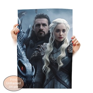 May include: Print featuring a fantasy art image of two people with a dragon. The woman has long, wavy, platinum blonde hair and is wearing armor. The man has dark hair and a beard. The print is labeled "Print Unframed 200 gsm."
