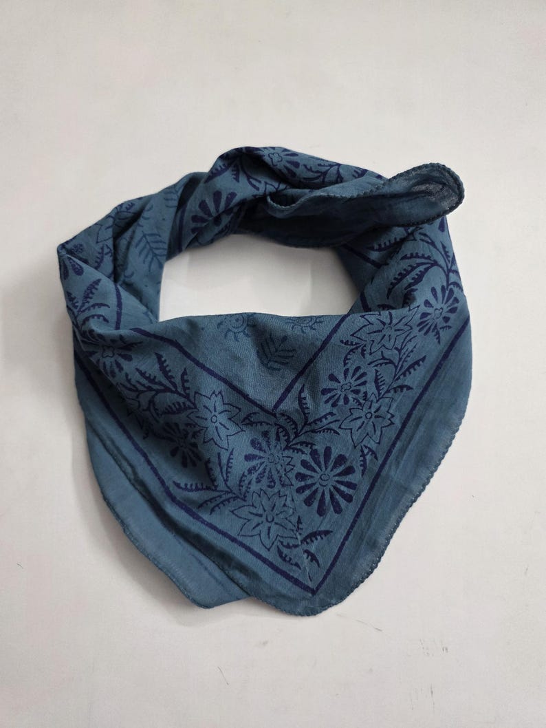 May include: A white ceramic mug with a black handle and the text "But First, Coffee" in a black, bold font. The mug is on a white surface.