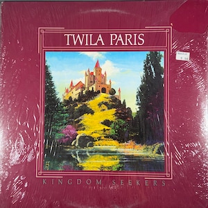 May include: A vinyl record album by Twila Paris, titled "Kingdom Seekers." The album cover features a painting of a castle atop a hill, surrounded by trees and a body of water. The album is sealed in plastic.