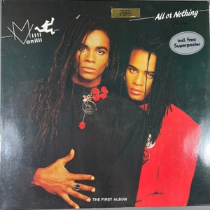May include: Album cover for Milli Vanilli's "All or Nothing." The cover features two men with long, braided hair, one in a black outfit and the other in a red jacket. The album title and band name are displayed in white text.