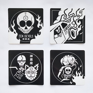May include: Four black and white stickers with a skull and flames design. The stickers feature the text "Zen Devils" and the Japanese characters for "Zen Devils".