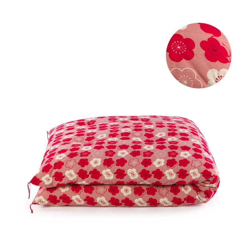 May include: A rectangular floor mattress featuring a repeating pattern of stylized plum blossoms in shades of red, pink, and white on a dusty rose background. A circular inset shows a magnified view of the floral print and fabric texture.