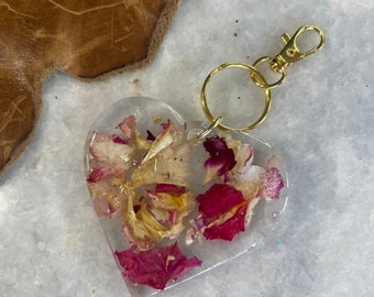 Handmade resin keychain with hand-grown, dehydrated roses embedded in clear resin in heart shaped form!