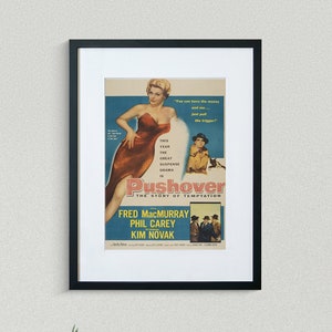 May include: A vintage movie poster for the film "Pushover" starring Fred MacMurray, Phil Carey, and Kim Novak. The poster features a woman in a red dress and the text "This year the great suspense drama is Pushover - The Story of Temptation".