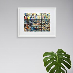 May include: A framed photograph of a colourful, abstract, geometric pattern. The pattern is made up of many small squares and rectangles, creating a sense of depth and movement. The frame is white and has a simple, modern design.