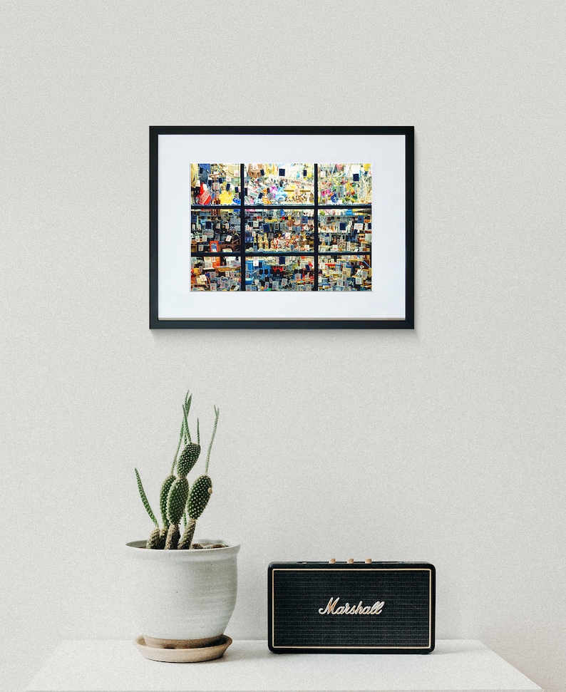 May include: A framed collage of colourful, abstract images. The collage is made up of 16 smaller images, each with a different design. The images are arranged in a grid pattern, and the frame is black.