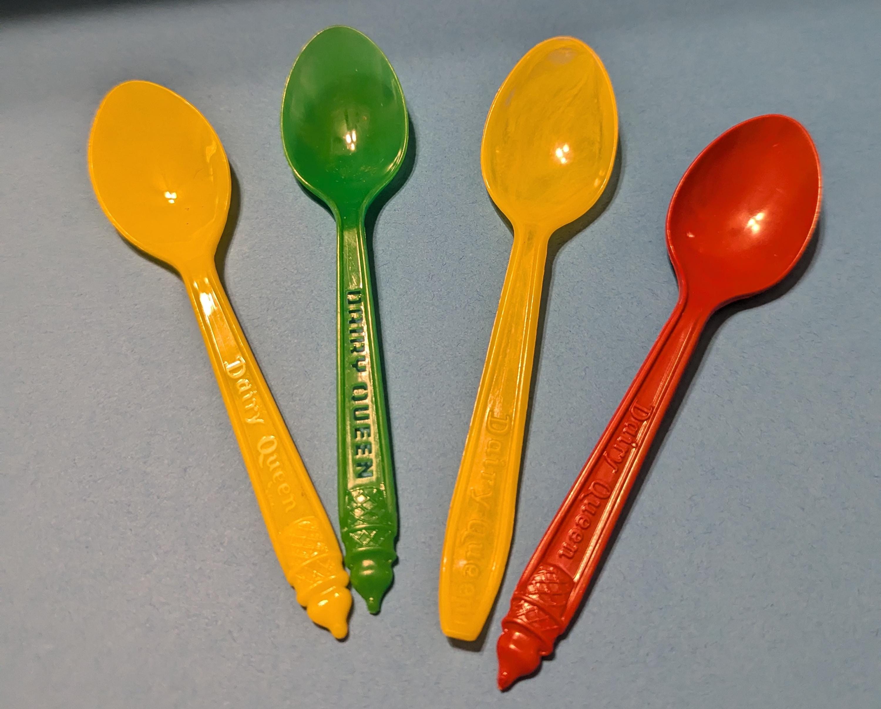 Four Vintage Dairy Queen Spoons. Two Yellow, One Red, and One