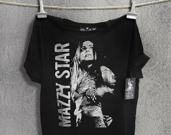 May include: Black t-shirt with a silver print of a woman's face and the text "The Mazzy Star" on the front.