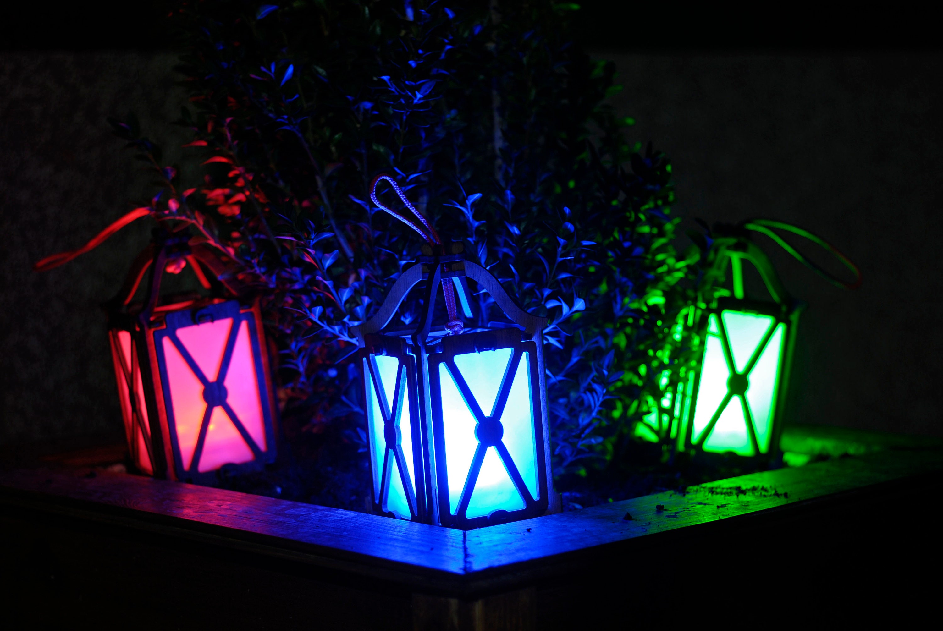 37 Inviting Christmas Front Porch Decor Ideas to Welcome Guests: Festive Ways to Wow Your Neighbors 22 Criss Cross lantern with color changing LEDs for porch or patio…