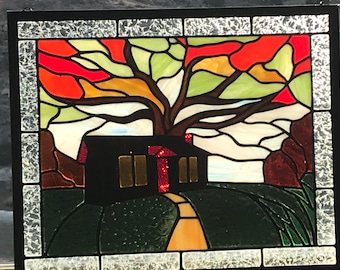 Autumn’s Eve at the Cabin stained glass window panel.