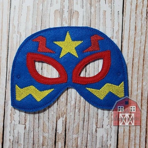 May include: Blue felt superhero mask with a yellow star and red eye holes. The mask has a yellow lightning bolt design on the bottom.