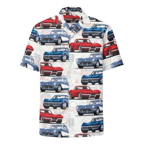 May include: A short-sleeve button-down shirt featuring an all-over print of vintage red and blue sports cars on a white background. The design includes various classic car models arranged in a repeating pattern across the fabric surface.