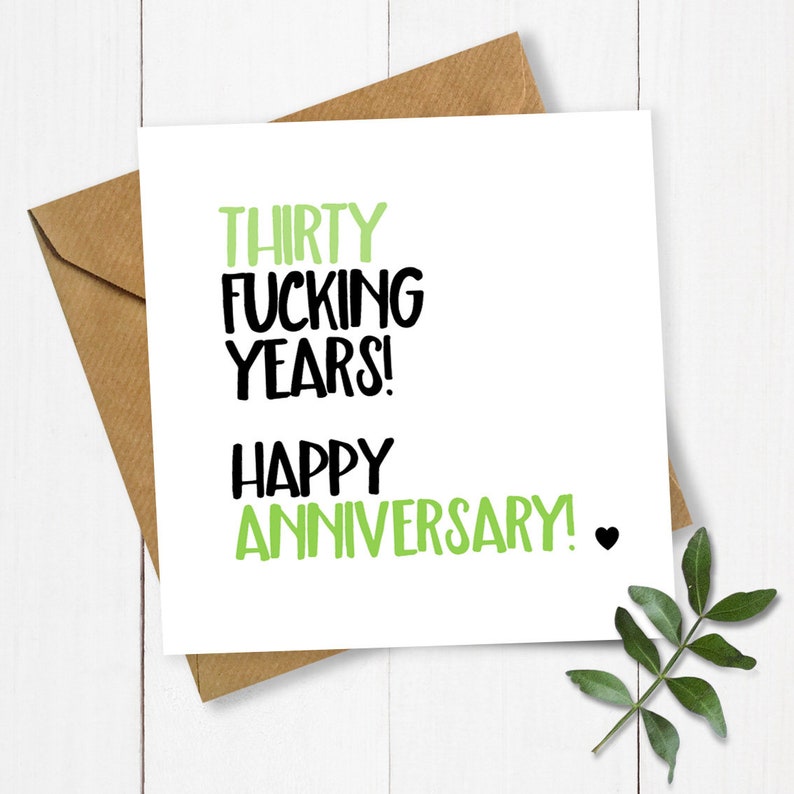 May include: A white card with black and green text that reads "Thirty Fucking Years! Happy Anniversary!" with a small black heart.