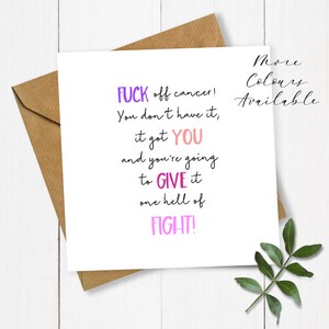 May include: A white greeting card with a brown envelope. The card has text in purple and pink that reads "FUCK off cancer! You don't have it, it got YOU and you're going to GIVE it one hell of FIGHT!" The words "More Colours Available" are also on the card.
