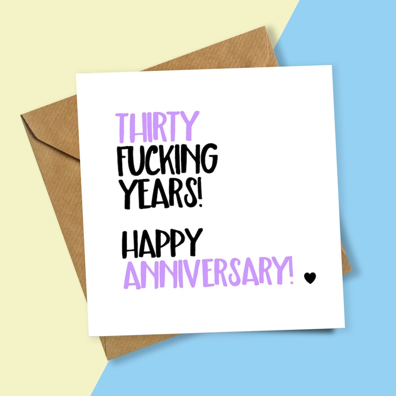 May include: A white card with the text "Thirty Fucking Years! Happy Anniversary." in black and purple lettering. A small black heart is at the end of the text.