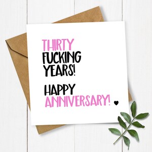 May include: A white card with black and pink text that reads "Thirty Fucking Years! Happy Anniversary!" with a small black heart.