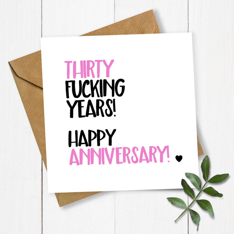 May include: A white card with black and pink text that reads "Thirty Fucking Years! Happy Anniversary!" with a small black heart.