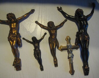 5 metal crucifixes