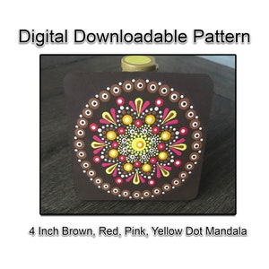 May include: A 4 inch brown, red, pink, and yellow dot mandala on a brown square background.