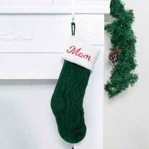 personalized green Christmas stocking for holiday home decoration.
