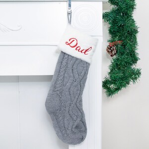 personalized gray Christmas stocking for holiday home decoration.