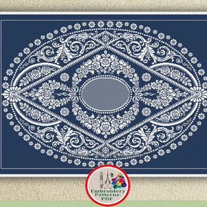 May include: A white embroidery pattern on a dark blue background. The pattern features a large oval with intricate floral designs and a smaller oval in the center. The text "Embroidery Patterns PDF" is visible in the lower right corner.