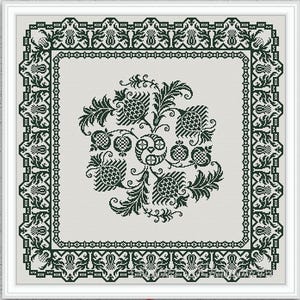 May include: A square cross-stitch pattern featuring a dark green botanical design on a light gray background. The central motif consists of stylized pomegranates and leaves, surrounded by a detailed geometric border of repeating floral elements.