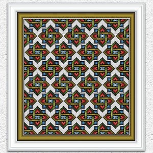 Może przedstawiać: Oprawiony wzór haftu krzyżykowego z powtarzającym się geometrycznym wzorem w kolorach czerwonym, zielonym, niebieskim i brązowym na białym tle. Rama jest biała ze złotą obwódką wewnętrzną. Obraz zawiera tekst "Embroidery Patterns PDF" i "INSTANT DOWNLOAD PDF".