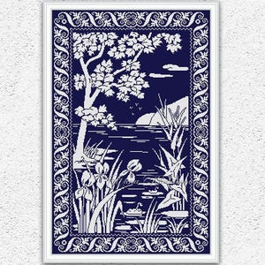 May include: A cross stitch pattern featuring a white silhouette of a lake scene with trees, flowers, and a swan on a dark blue background. The pattern is framed with a decorative border.