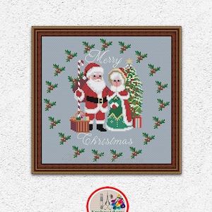 May include: Cross stitch pattern featuring Santa Claus and Mrs. Claus standing next to a Christmas tree with a holly wreath around them. The text "Merry Christmas" is below them.