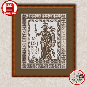 May include: A cross-stitch pattern featuring a black and white image of the Roman goddess Minerva, holding a spear and shield. The pattern is framed in a brown frame with a Greek key border. The text "MINERVE" is written below the image.
