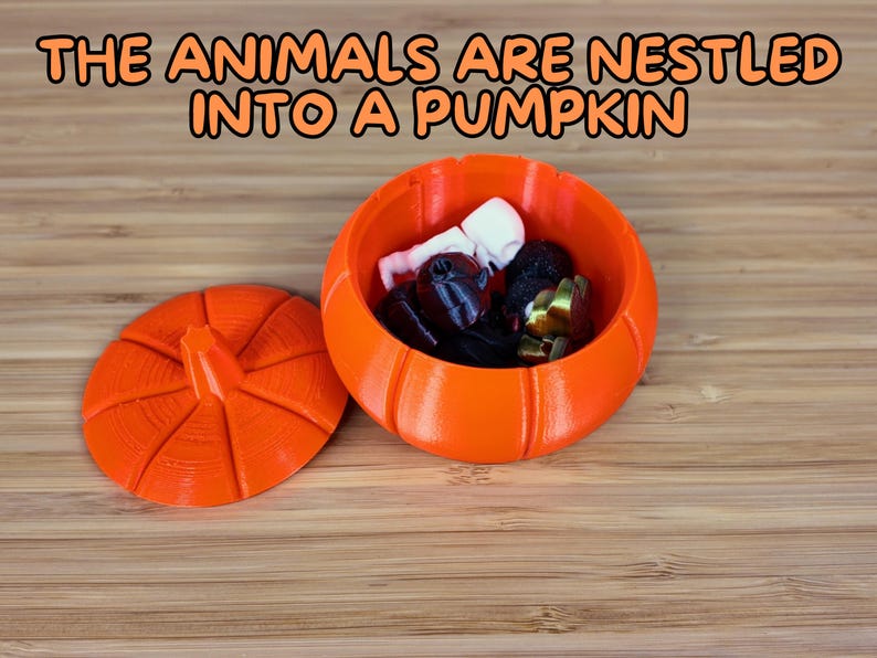 May include: An orange pumpkin-shaped container with a lid, filled with small decorative items. The container is made of plastic and has a textured surface. The text "THE ANIMALS ARE NESTLED INTO A PUMPKIN" is displayed above the container.