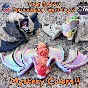 halloween themed tiny bat, articulating joints flying random mystery colors, unique Halloween home decor, hanging flying bats, indoor outdoor. 3d printed fidget toys