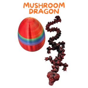 May include: A red and rainbow striped egg with a red mushroom dragon toy made of small pieces. The toy is curled up in a coil shape.
