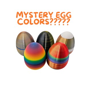 May include: Five Easter eggs, each with a different color and pattern. The eggs are arranged in a semi-circle, with the text "MYSTERY EGG COLORS?????" above them.