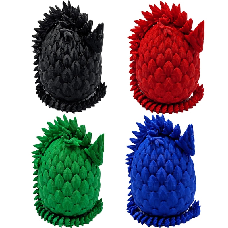 May include: Four dragon egg-shaped toys, each with a different color: black, red, green, and blue. The eggs are made of a textured material that resembles scales.