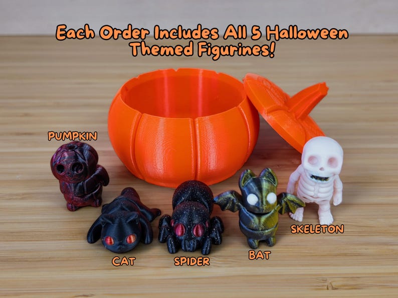 May include: Five Halloween-themed figurines, including a pumpkin, cat, spider, bat, and skeleton, are displayed on a wooden surface. The figurines are arranged in a semi-circle around an orange pumpkin-shaped container with a lid. The text "Each Order Includes All 5 Halloween Themed Figurines!" is displayed at the top of the image.