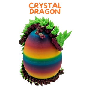 May include: A rainbow-colored egg with a green and purple crystal dragon curled around it. The dragon has a spiky, crystal-like design.