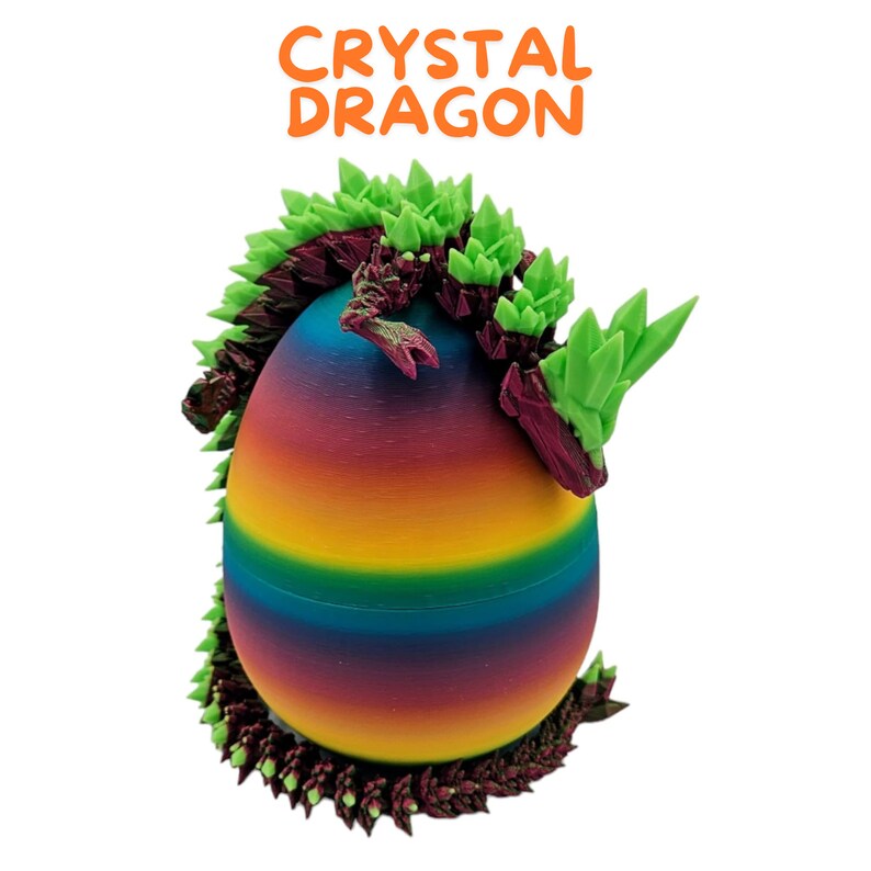 May include: A rainbow-colored egg with a green and purple crystal dragon curled around it. The dragon has a spiky, crystal-like design.