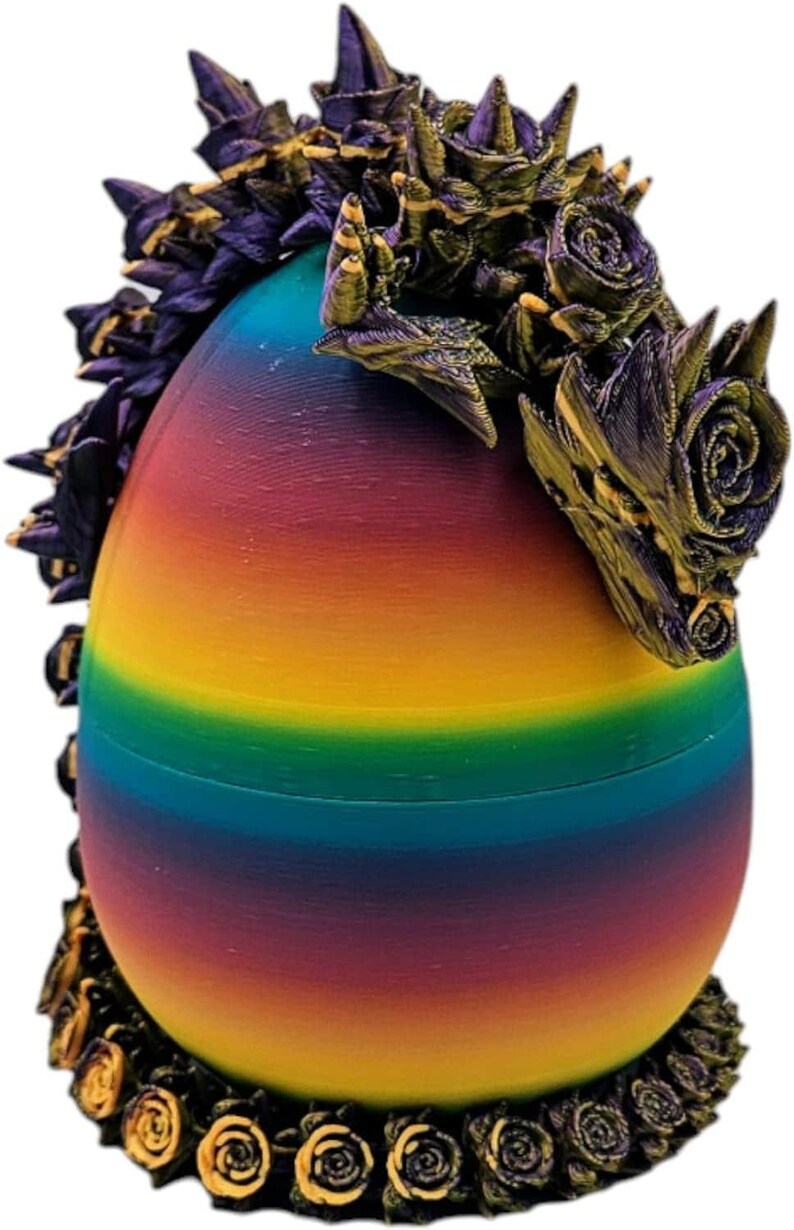 May include: A rainbow egg with a purple and gold dragon head with roses around the top and bottom.